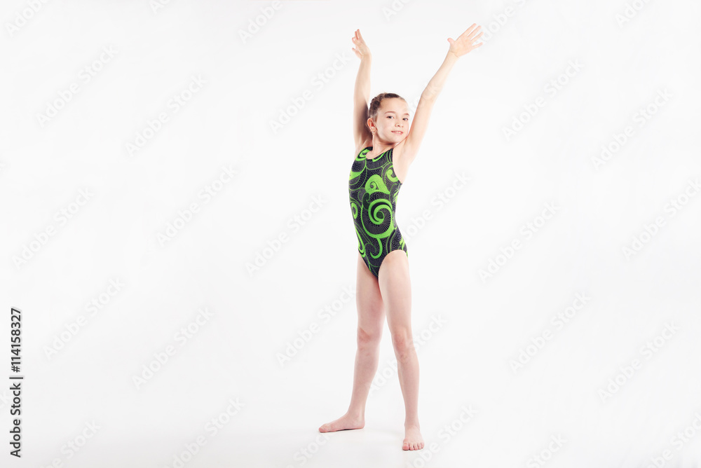 Fototapeta premium little girl acrobat. exercises. fitness