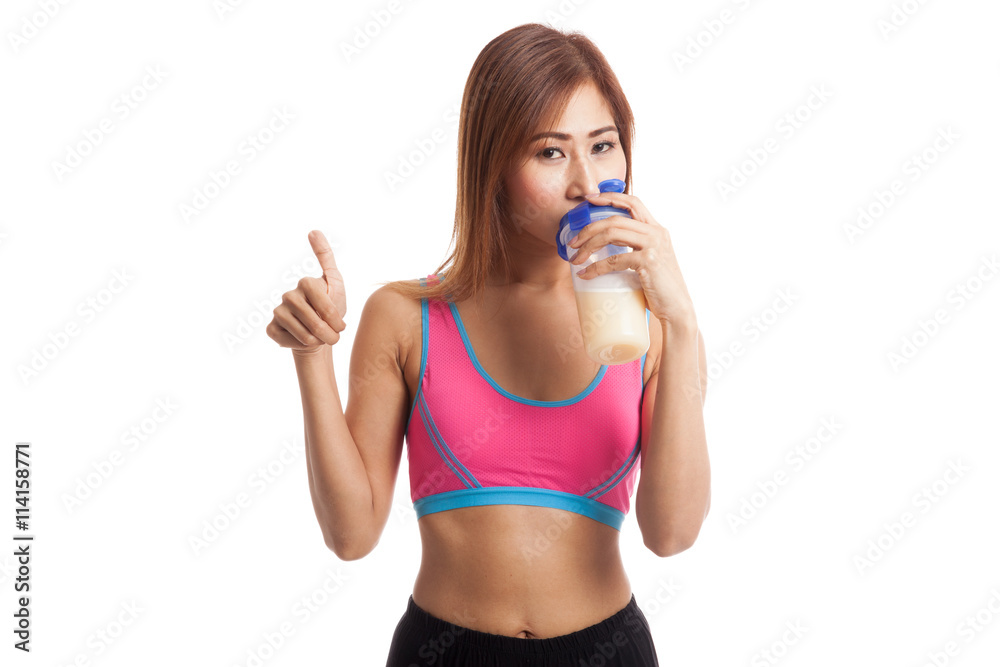 Beautiful Asian healthy girl show thumbs up drink whey protein Beautiful Asian healthy girl show thumbs up drink whey protein