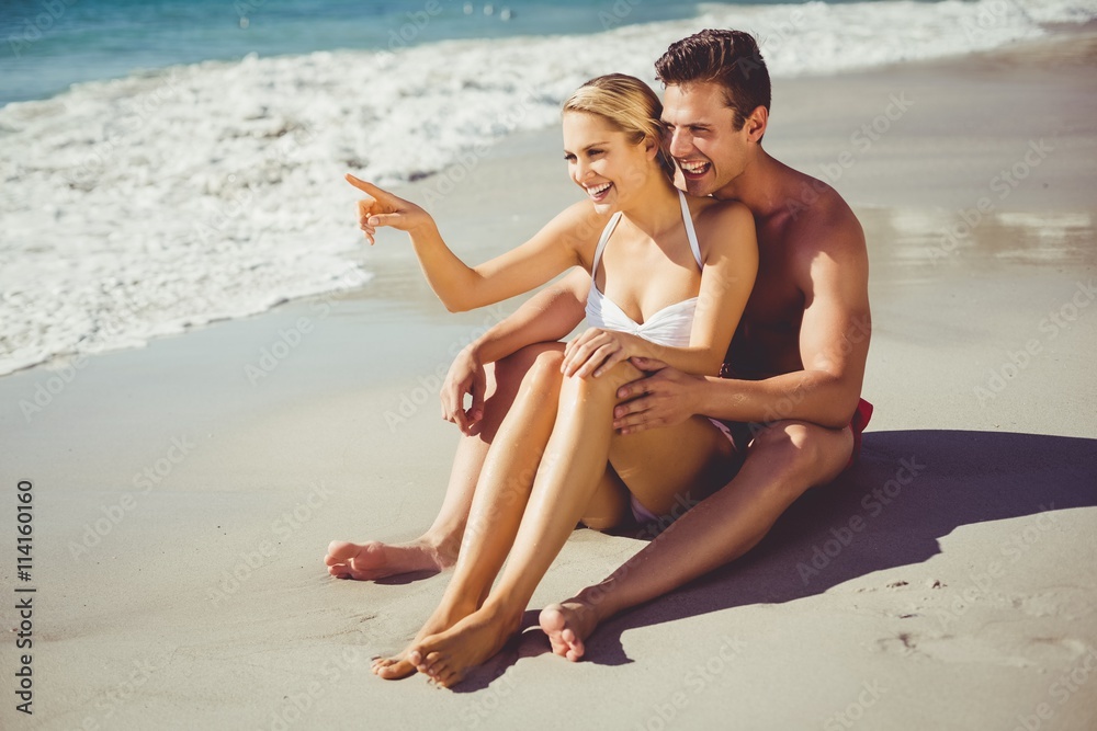 Fototapeta premium Couple having fun on beach