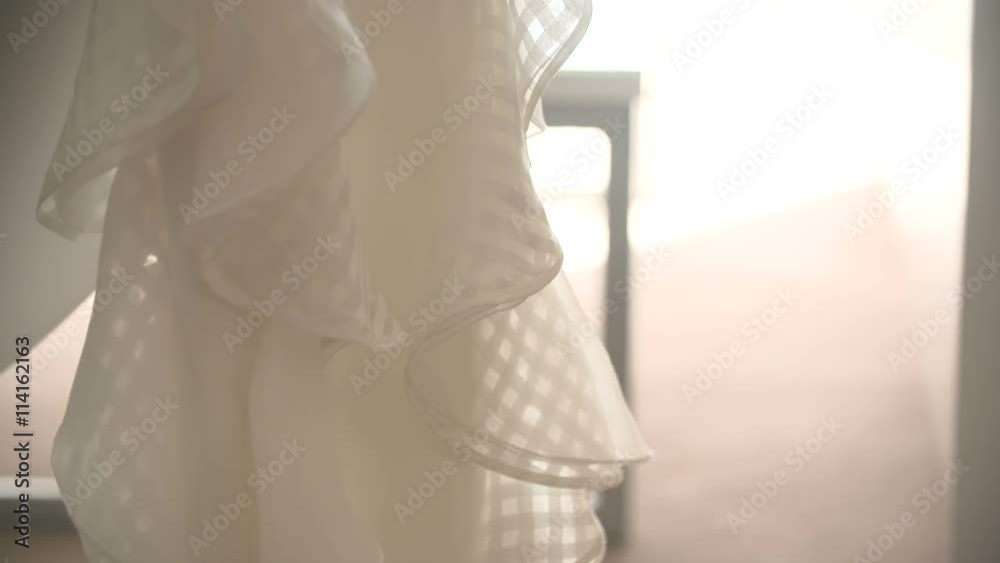 Beautiful white wedding dress for bride on bed. Beautiful white wedding dress for bride on bed.