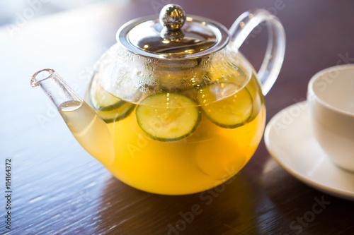 Transparent teapot on a table