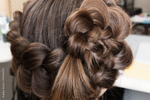 weave beautiful braids in hairdressing salon