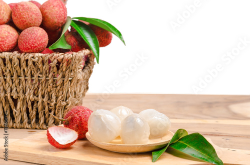 peelled lychee on wooden