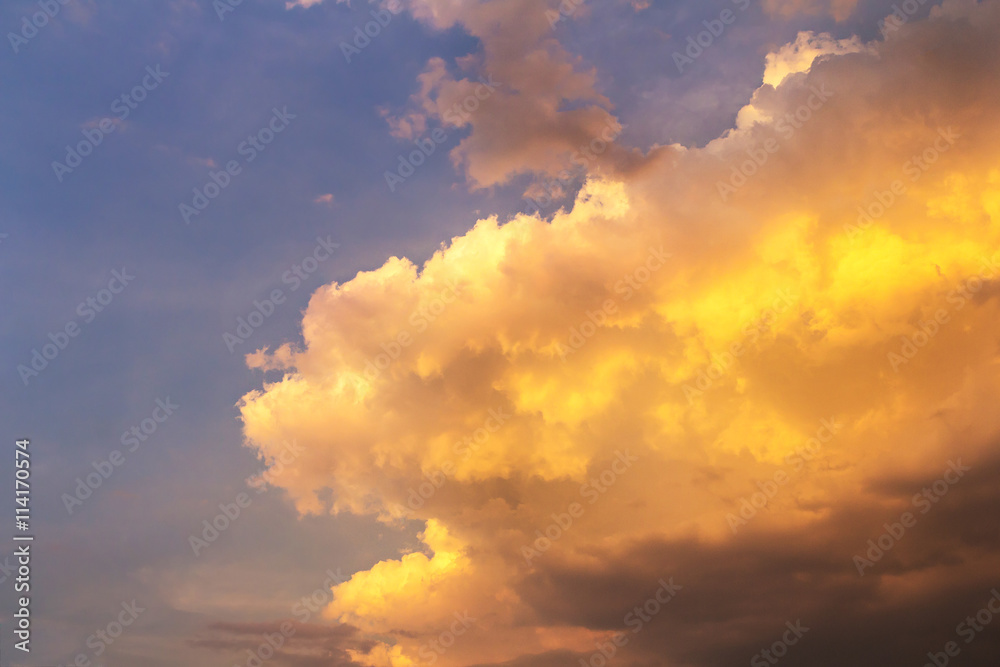 Golden clouds on blue sky background