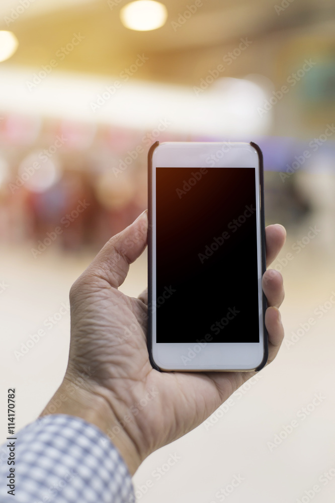 Hand hold blank smartphone close up Hand hold blank smartphone close up