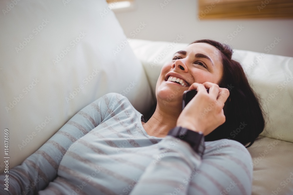 Smiling woman talking on phone Smiling woman talking on phone