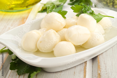approach of mozzarella cheese balls with parsley