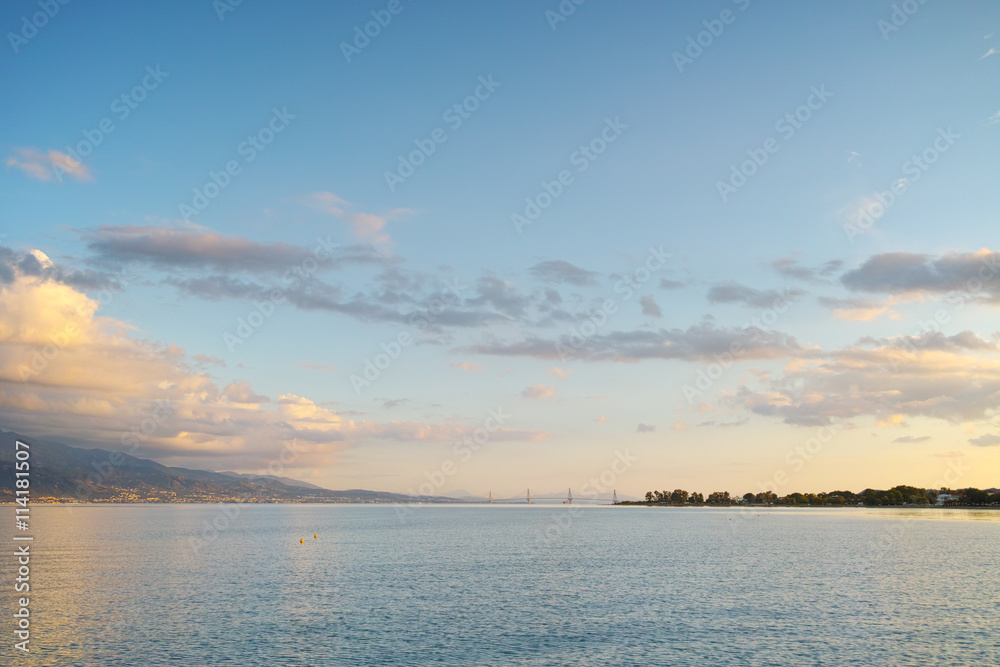 Sunset over The cable bridge between Rio and Antirrio view from Nafpactos, Patra, Western Greece Sunset over The cable bridge between Rio and Antirrio view from Nafpactos, Patra, Western Greece