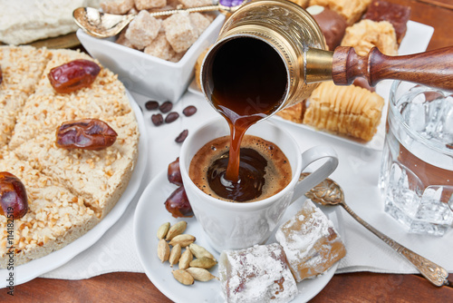 Traditional Turkish black coffee and sweet dainties