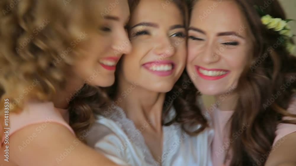 Happy bride with her friends showing gestures with their hands Happy bride with her friends showing gestures with their hands