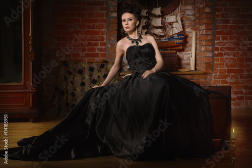 Sensual gothic woman in a long gorgeous black dress