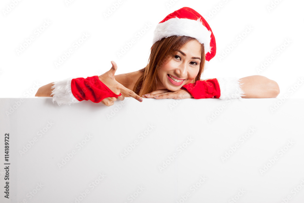 Asian Christmas girl with Santa Claus clothes with blank sign Asian Christmas girl with Santa Claus clothes with blank sign