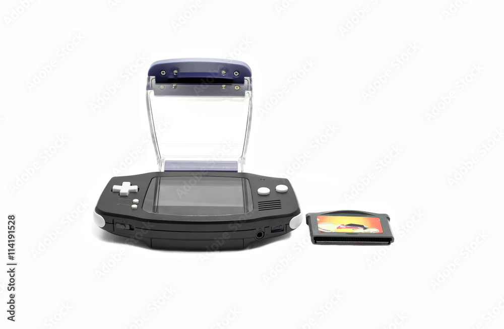 Old portable game console with game box isolated Old portable game console with game box isolated