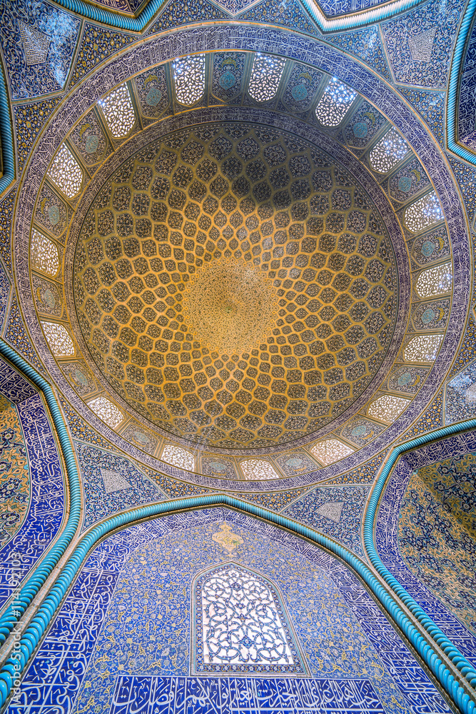 Isfahan, Iran - December 13, 2015: Sheikh Lotfollah Mosque at Naqhsh-e Jahan Square in Isfahan, Iran. Ceiling view.