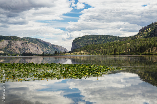 Reflections on a lake on a mountainous area. Taken near Kelowna, British Columbia, Canada.