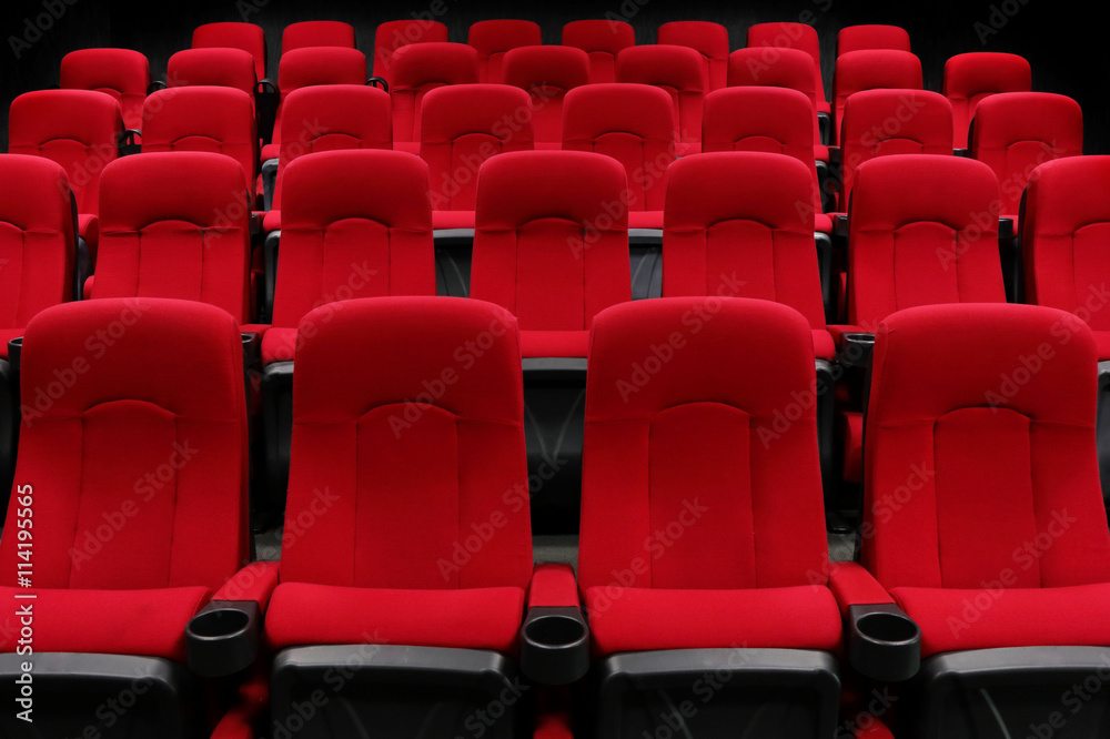 Empty theater auditorium or cinema with red seats
