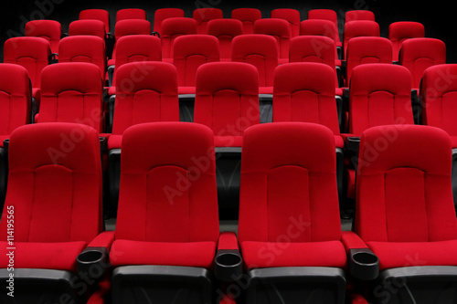 Empty theater auditorium or cinema with red seats © thanasak