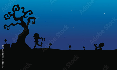 Halloween zombie in tomb silhouette