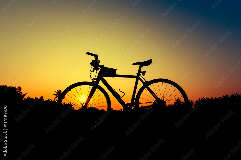 Fototapeta premium Silhouette bicycles on sunset sky