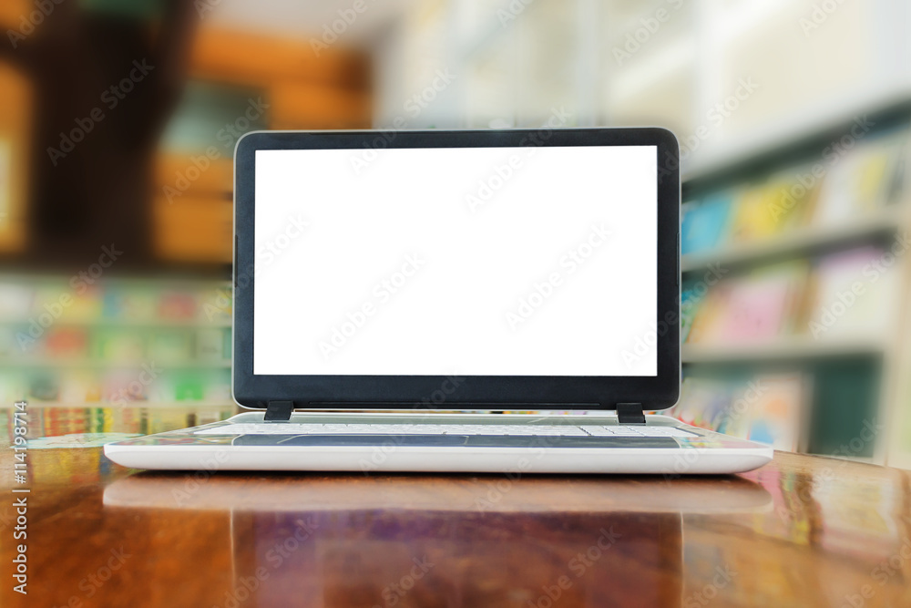 Laptop with copy space white window on wooden table against boke