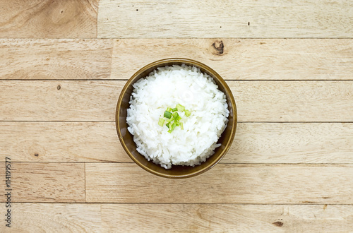 Cooked rice on wood table at top view