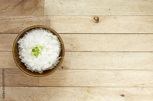 Cooked rice on wood table at top view