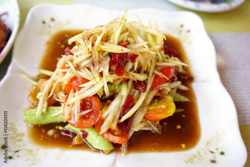 Thai spicy food som tum or papaya salad closeup selective focus Thai spicy food som tum or papaya salad closeup selective focus