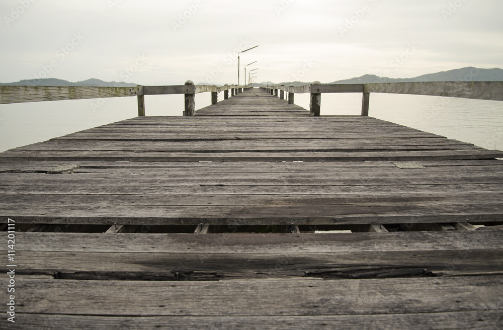 Fototapeta premium The wood bridge on the time in beautiful day, Ranong Thailand 