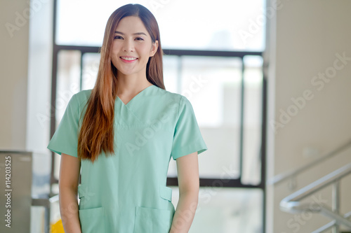 Portrait of friendly female doctor smiling Free Download Portrait of friendly female doctor smiling - GFXLoad