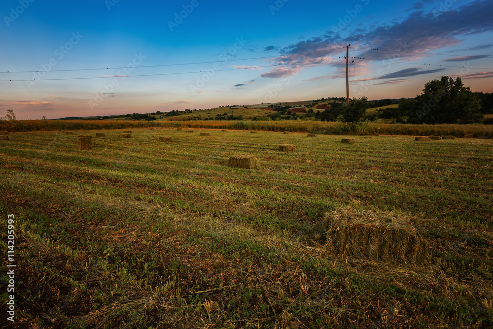 Sunset around bales of hay in the summer, near Burgas city, Bulgaria