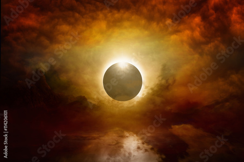 Full sun eclipse in dark red sky, end of world