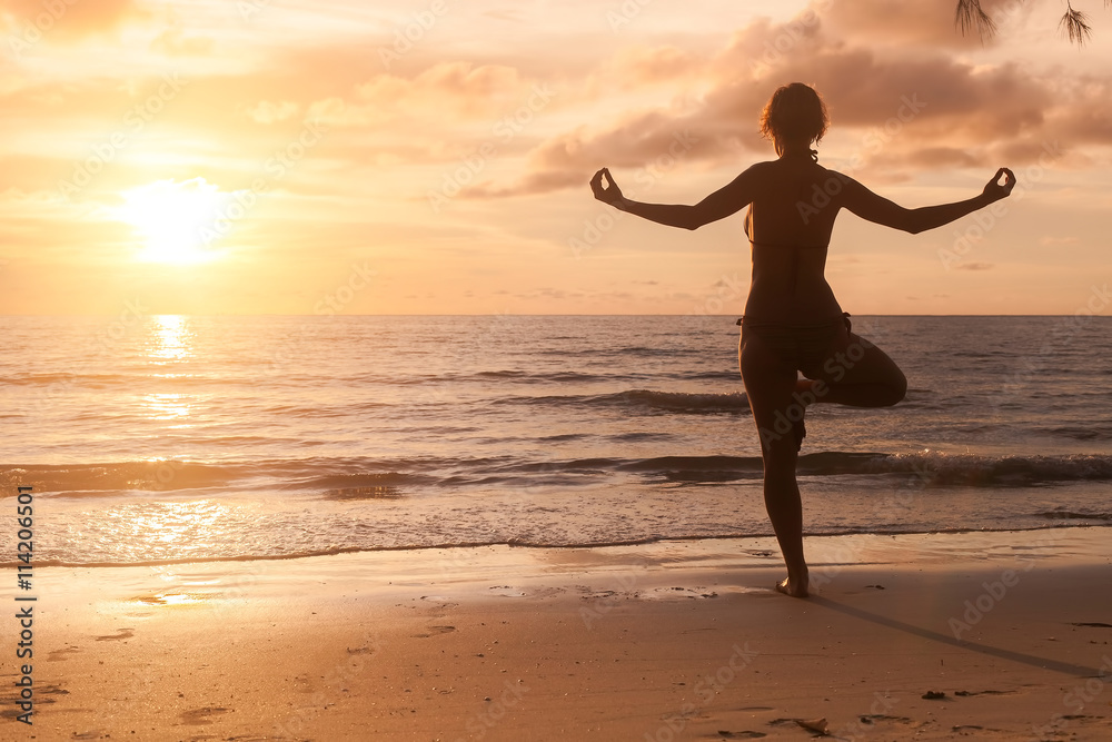 Yoga girl silhouette on beautiful sunset on the sea. Yoga girl silhouette on beautiful sunset on the sea.
