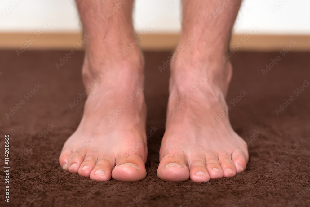 Itchy cold feet resting on the floor. Itchy cold feet resting on the floor.