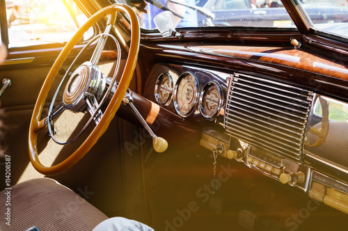 Interior of a classic vintage car with sun glare