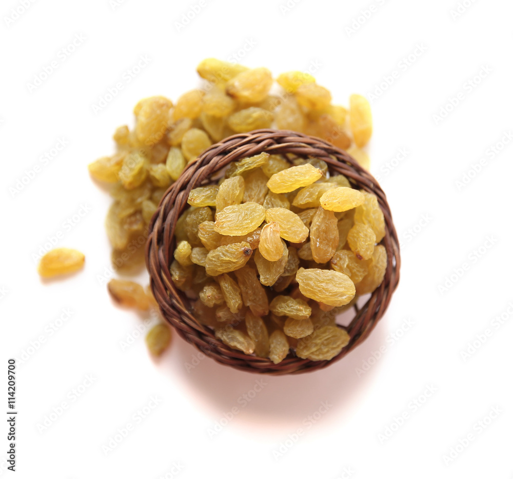 Fototapeta premium Raisins wooden basket on a White background