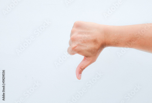 hand thumb down on white background