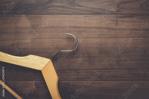 clothing hanger on the brown wooden table
