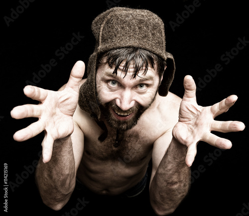 Fotografie Dark portrait of scary evil sinister bearded man with smirk, makes various hand's signs and expresses different emotions