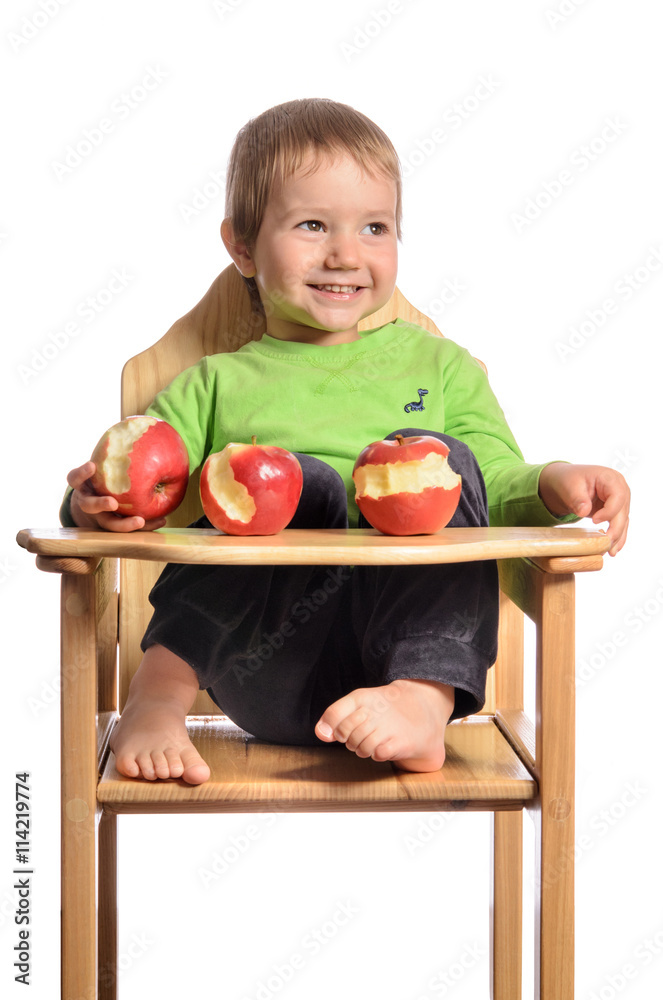 Fototapeta premium Cute child with red apples on white background