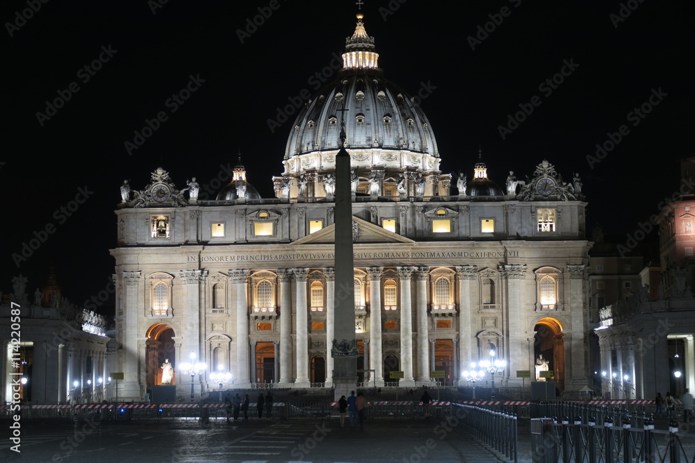 Naklejka premium Rome, Vatican – summer 2016. St. Peter's Basilica at night with barriers. The Papal Basilica of St. Peter has installed extra crowd barriers leading to the entrance.