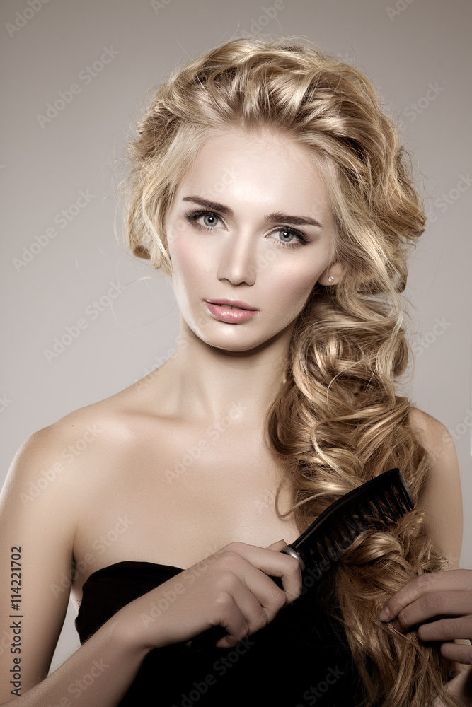 Naklejka premium Model with long braided hair. Waves Curls Braid Hairstyle. Hair
