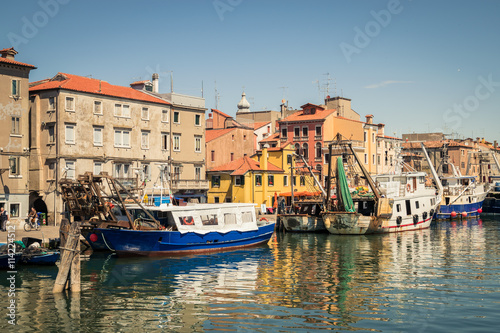 Fishing boats moored in a canal in Chioggia  Italy.
