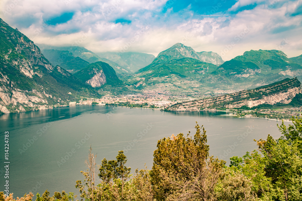 Naklejka premium Panorama of the gorgeous Lake Garda surrounded by mountains.