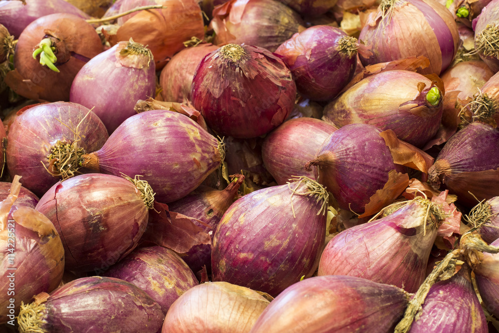 Red onions bulbs on a market in Arequipa, Peru. Red onions bulbs on a market in Arequipa, Peru.