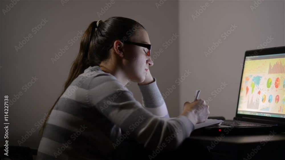 Sleepy exhausted woman working at home with her laptop, her eyes are closing and she is about to fall asleep, sleep deprivation and overtime working concept Sleepy exhausted woman working at home with her laptop, her eyes are closing and she is about to fall asleep, sleep deprivation and overtime working concept