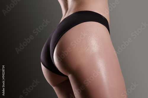 Female sexy body in black underwear.  Woman body care.