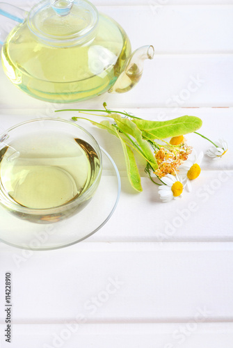 teapot and cup herbal tea wood background 