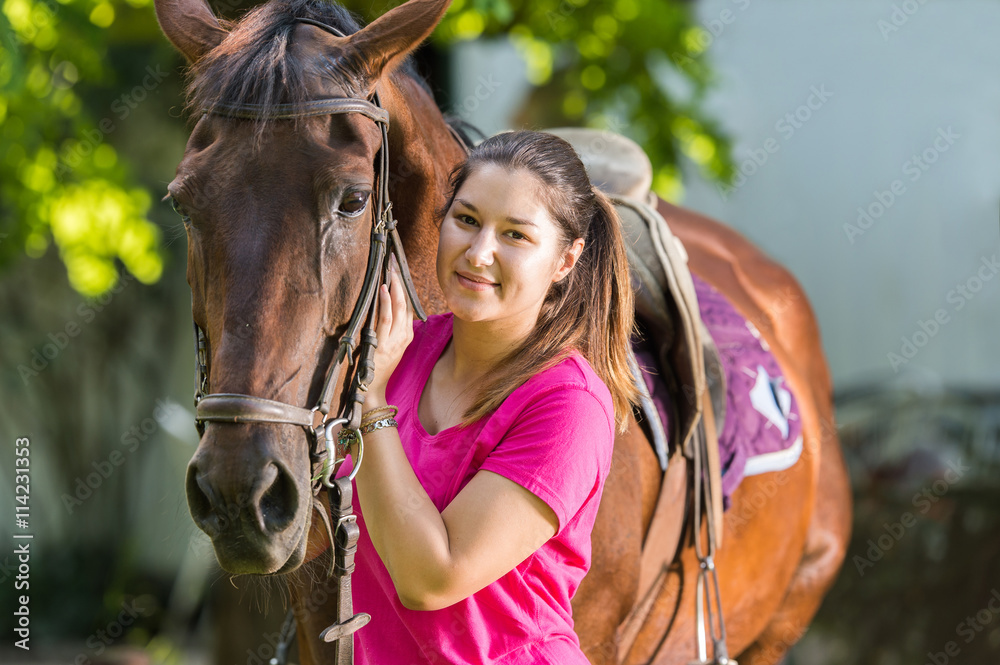 Obraz premium Beautiful girl with a horse
