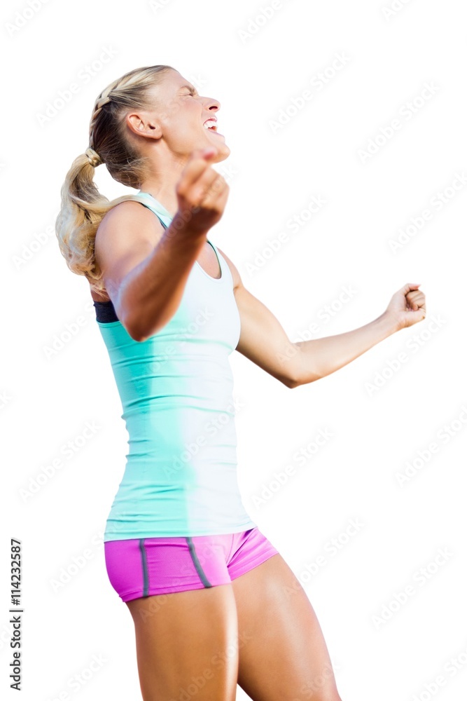 Low angle view of sportswoman celebrating her victory Low angle view of sportswoman celebrating her victory