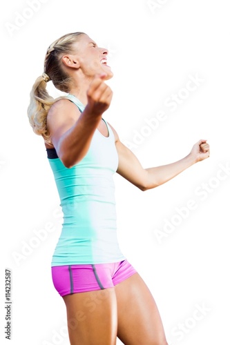 Low angle view of sportswoman celebrating her victory © vectorfusionart